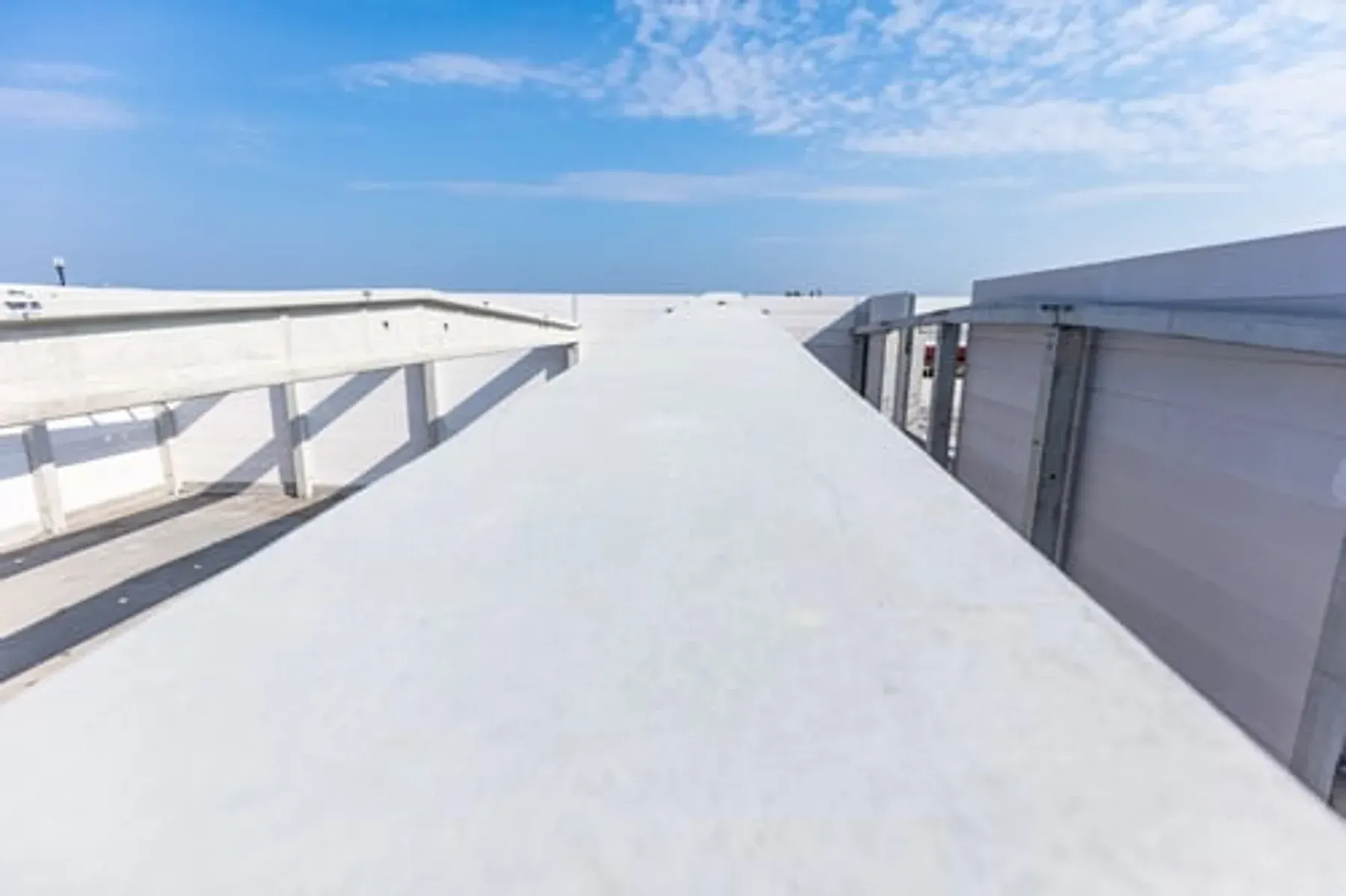 Finished flat roofing system on a commercial building under a clear sky